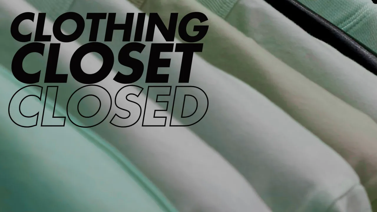 Clothing Closed Closed text overlays an up close photo of a rack of clothing 
