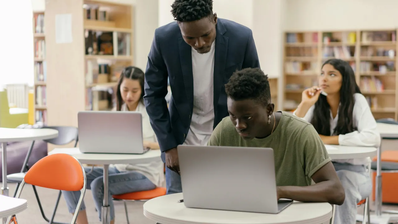 Teacher helping a student