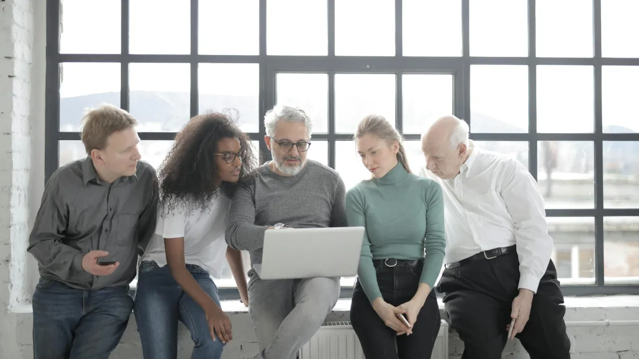 People looking at computer