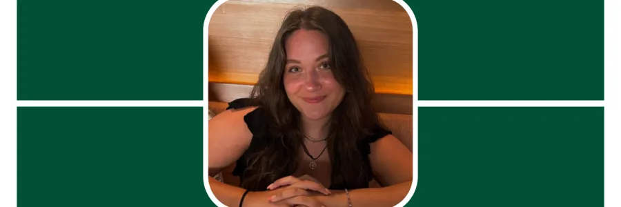 Allie is at the center of a green grid; She is smiling, wears a black shirt, and her arms are folded in front of her.