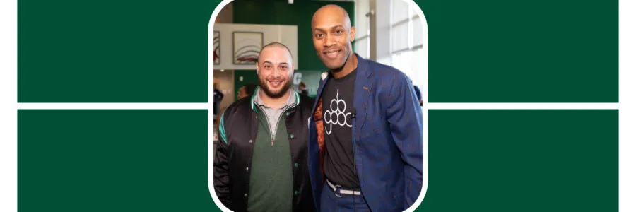 Chris Moxley of Do Good and 704 shop poses with an alumni at a UNC Charlotte speaking event