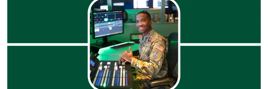 Walter Kirkland poses at a data station in his space force uniform holding up the niner pick axe hand sign