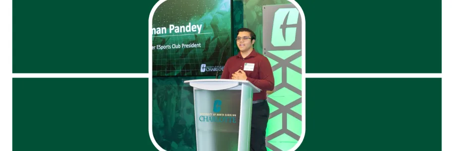 Anshuman stands at the Charlotte podium during an Esports event, speaking to a crowd