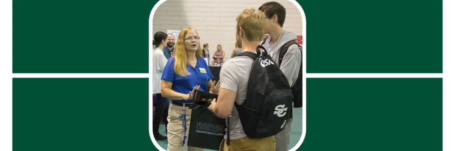 Recruiter at a UNC Charlotte Career Fair speaks with two students