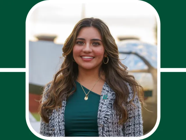 Lizbeth is in the middle of the green quadrants, she smiles brightly and wears a professional blazer