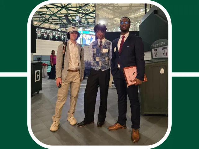 Students at the Charlotte Career Fair pose in their professional clothing and resumes