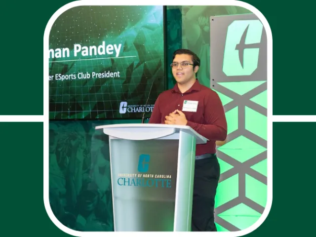 Anshuman stands at the Charlotte podium during an Esports event, speaking to a crowd