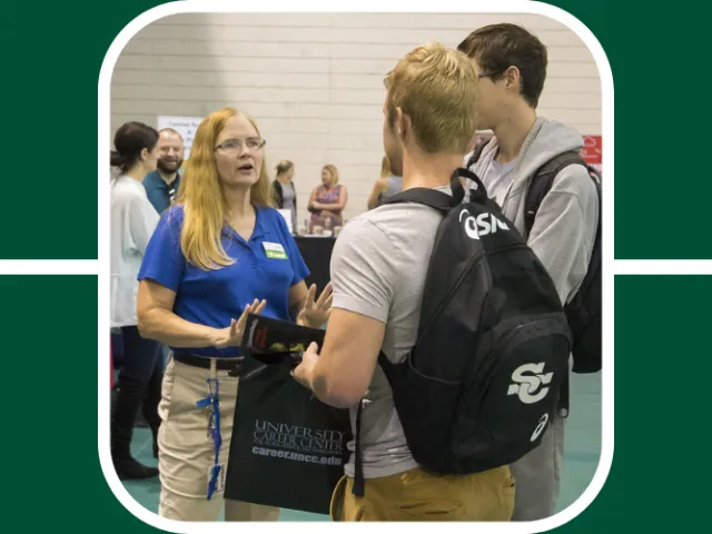 Recruiter at a UNC Charlotte Career Fair speaks with two students