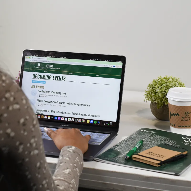 Student browsing Career Event page on laptop