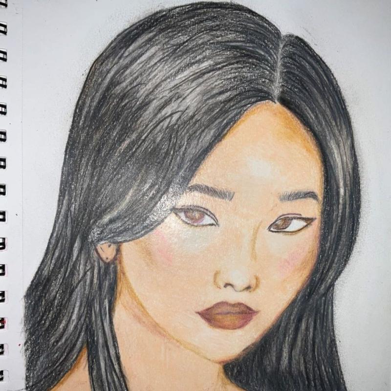 Drawing of a girl's face with black hair 