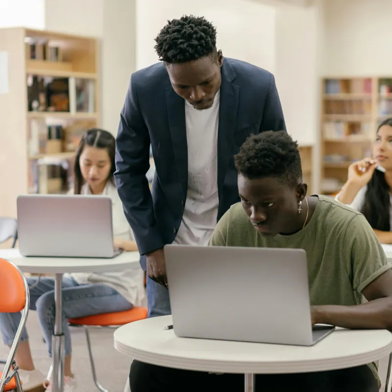 Teacher helping a student