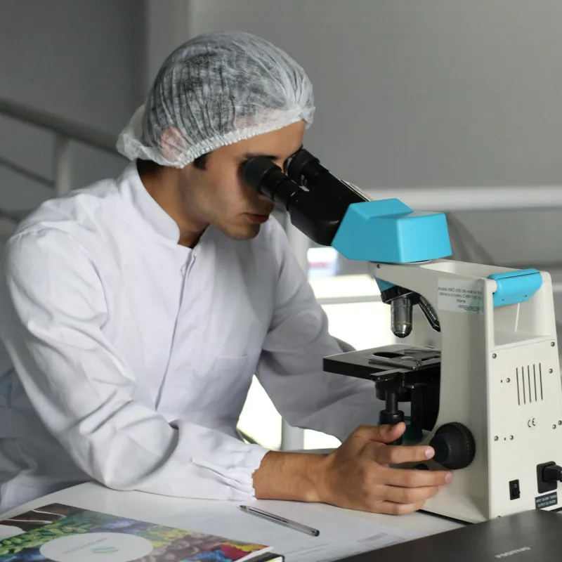 Man using microscope